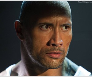 Driver (Dwayne Johnson) paces furiously in his cell as he awaits release